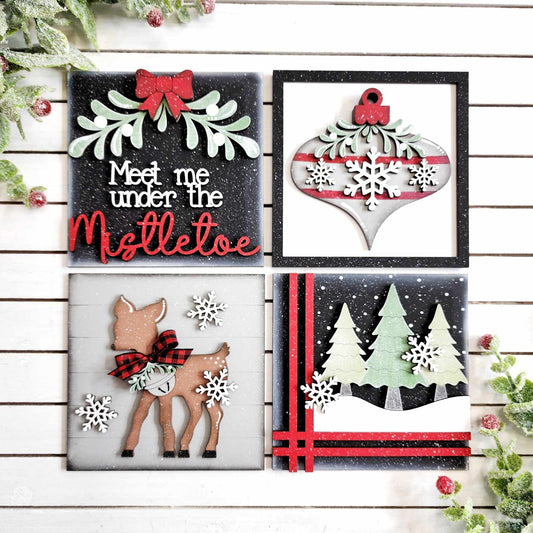Four Christmas-themed decorative panels on a wooden background.