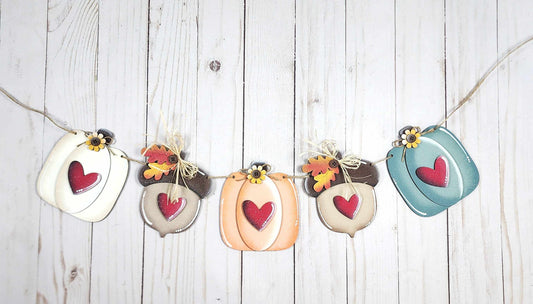 Laser cut fall banner with pumpkins and acorns